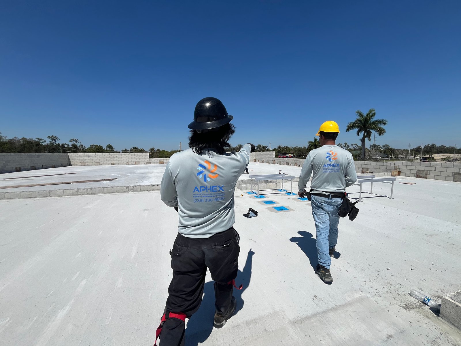 Aphex Mechanical working on a commercial rooftop unit