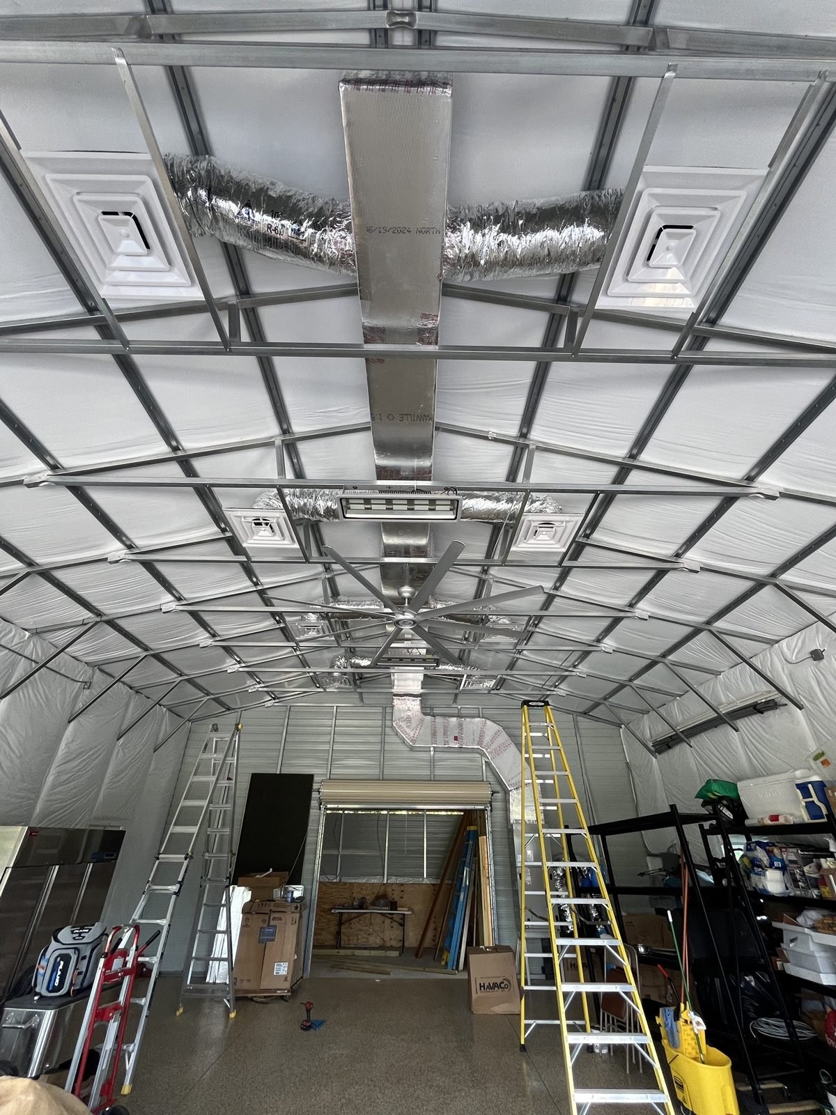 Metal warehouse, everything in the open. Four way diffusers, to airflow-max while duct mogging.