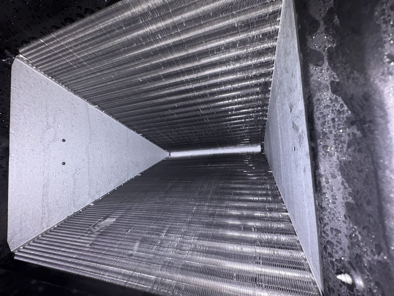 A coil with two years of run time. Maintained twice a year, every year. This is what AirCare looks like from the inside.