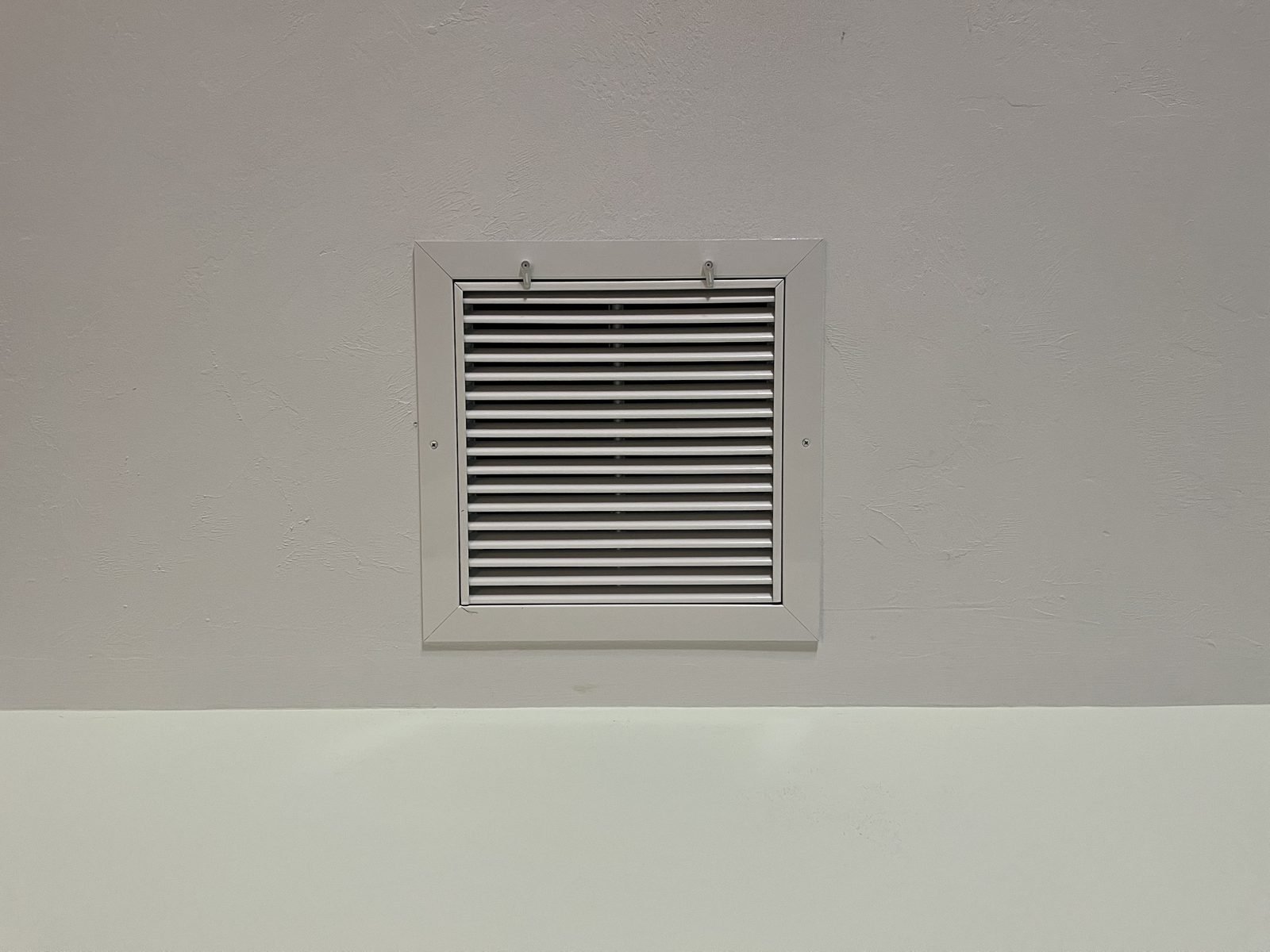 A return we added. The system was starving for air & the static pressure said so. One return later, the whistling stopped & the coil stopped freezing.