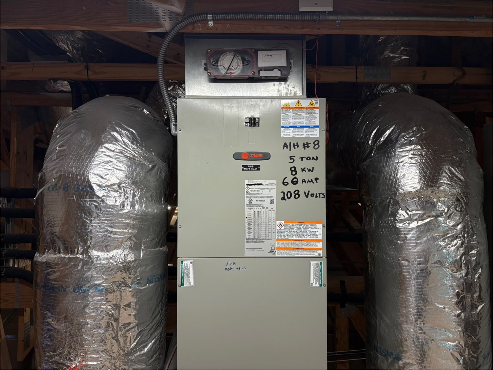 Trane air handler, labeled. Same on every one in the room.